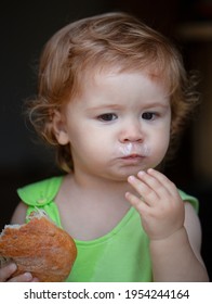 Cute Toddler Child Eating Sandwich, Self Feeding Concept