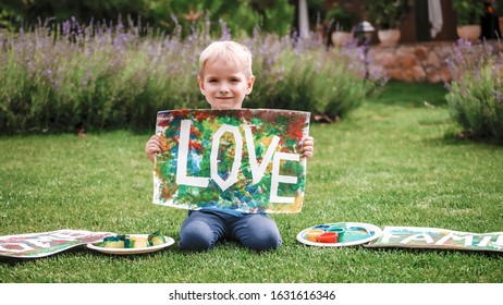 Cute toddler and darling hand print project kept his busy at home outside at summer  drawing posters created and tape   fingers  easy   funny DIY and kids  early art education concept