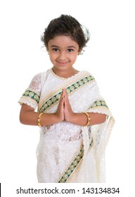 Cute Toddler Dressed In Saree With Folded Hands Representing Traditional Indian Greeting, Namaste, Isolated On White