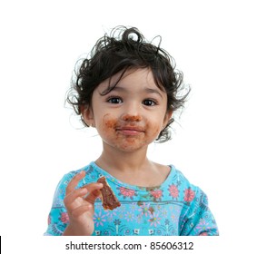 Cute Toddler Girl Eating A Chocolate Cookie, Isolated, White