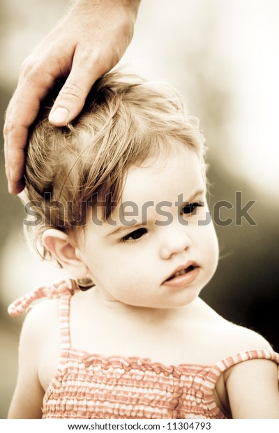 cute-toddler-her-dads-hand-600w-11304793.jpg