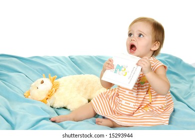 Cute Toddler Holding A Book Up To Be Read To