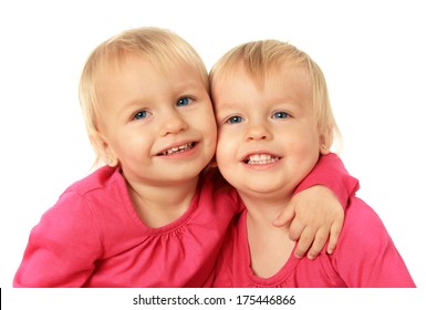 Cute Two Year Old Identical Twin Girls Hugging.