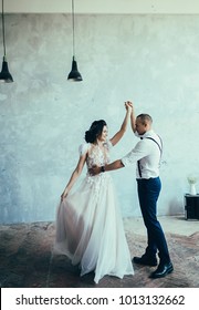 Cute Wedding Couple Dancing At Loft Interior