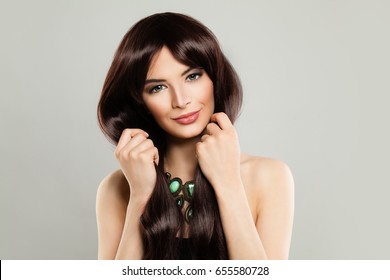 Cute Woman Fashion Model With Long Brown Silky Hair And Makeup On Background. Barber Shop Or Beauty Salon Background