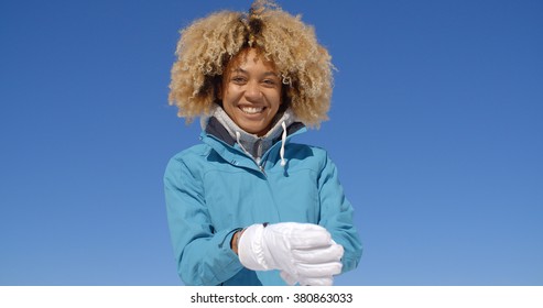 Cute Woman In Frizzy Hair And Winter Coat