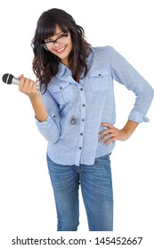 Cute Woman With Her Hand On Hip Holding Microphone On White Background