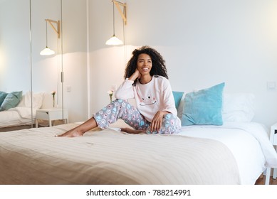 Cute Woman On Bed Smiling Wearing Pyjama