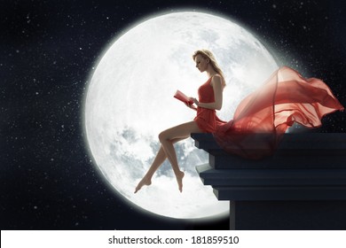 Cute Woman Over Full Moon Background