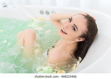 Cute Woman Resting In Whirlpool Bath