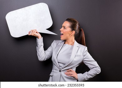 Cute Woman Screaming In Blank Speech Bubble Isolated On Black Background