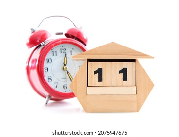 Cute Wooden Small Desk Calendar And Alarm Clock On White Background