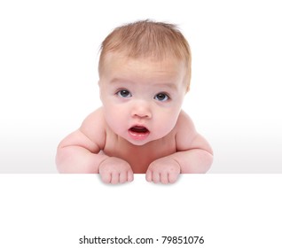 A cute young baby infant holding a sign over white background