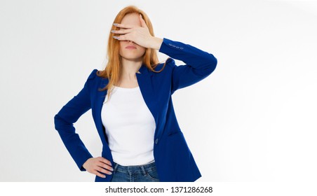 Cute, young beautiful red hair woman do facepalm. Redhead girl headache failed to upset business face palm. Portrait of female doing facepalm posing against studio background.
