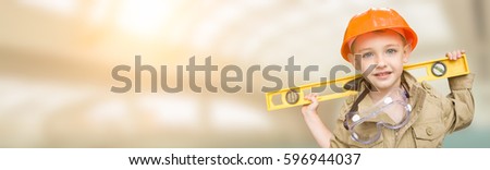 Cute Young Boy Dressed As Contractor Holding Level Wide Banner with Room For Text.