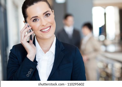 Cute Young Businesswoman Talking On Cell Phone