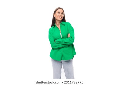 cute young european brown-eyed female model with well-groomed black hair and make-up dressed in a green shirt - Shutterstock ID 2311782795