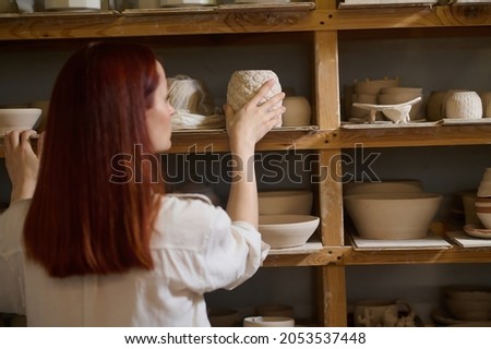 Similar – Beautiful ceramist owner looking to the camera while smiling