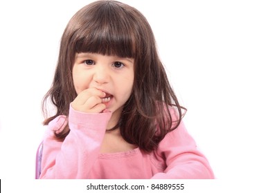 Cute Young Four Year Old Child Holding Her Tooth Which May Be Loose Or Aching