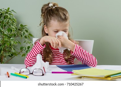  Cute  Young Girl Child In Glasses Sneezing In A Tissue Blowing His Runny Nose