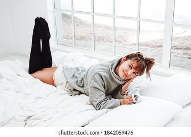 Cute Young Girl Cosy Winter With Coffee In Bed