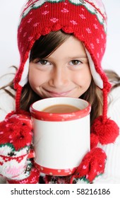 A Cute Young Girl Drinking Hot Chocolate