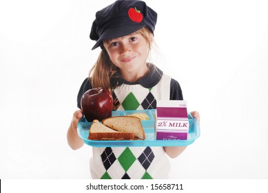 A Cute Young Girl Holding A School Lunch Tray