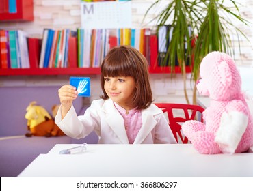 cute young kid playing a doctor in office