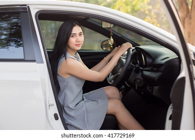 Cute Young Lady Happy Driving Car