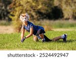 Cute young little kid girl wear cat furry mask enjoy have fun playing outdoors in forest street park. Children therian wild animal character trendy fan culture. Teenager social expression hobby