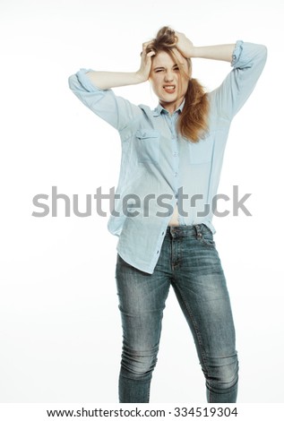 cute young pretty girl thinking on white background isolated close up, crazy emotional goofy fooling around
