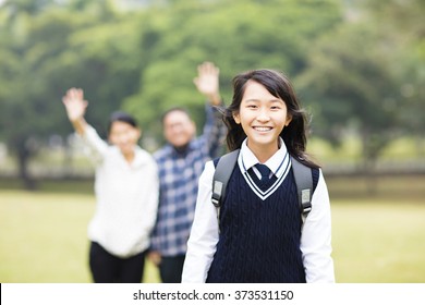 Cute Young Student Girl With Parent In School