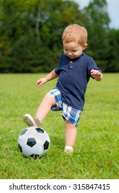 Cute Young Toddler Playing Soccer Or Football