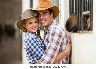 Cute Young Western Couple Hugging In Stable