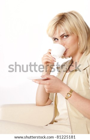 cute young woman with a cup on a white