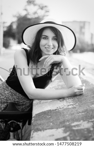 Image, Stock Photo Smiling girl with a hat pulling from her boyfriend hand in the street to take a walk.