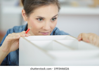 cute young woman doing some woodwork - Powered by Shutterstock