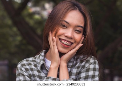 A Cute Young Woman In Happy Thoughts. Smiling About Her Beautiful Face And Successful Career In Life.