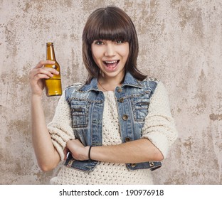 Cute Young Woman Holding A Bottle Of Beer