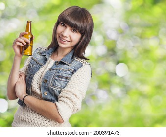 Cute young woman holding a bottle of beer