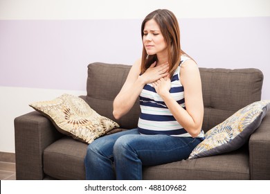 Cute Young Woman At Home Suffering From Heartburn During Her Pregnancy