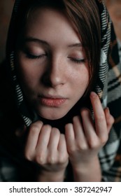 Cute Young Woman In Plaid With Her Eyes Closed. Close Up