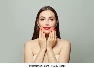 Cute Young Woman Showing Red Manicured Nails On Hands. Body Care And Manicure Concept