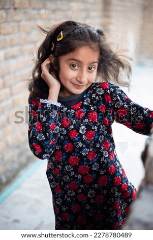 Similar – Happy adorable little girl smiling outdoors.