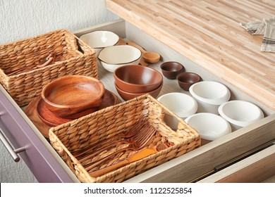 Cutlery And Dishware In Kitchen Drawer