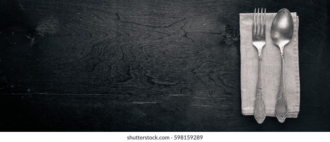 Cutlery. Fork And Spoon. On Wooden Background. Top View.