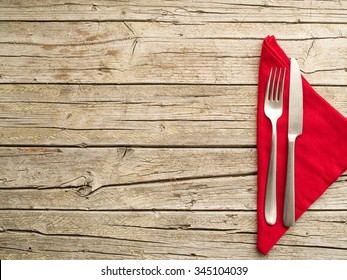 Cutlery kitchenware on old wooden boards background food concept - Powered by Shutterstock