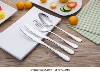Cutlery knife, fork and spoon combination, fruit and gourmet macaron platter