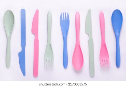 Cutlery Set Made Of Wheat Straw Of Pastel Colors In A Row On White Background. Reusable Utensils. School Lunch Concept