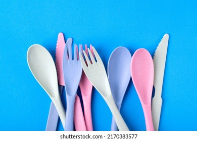 Cutlery Set Made Of Wheat Straw Of Pastel Colors On Blue Background. Reusable Utensils. School Lunch Concept